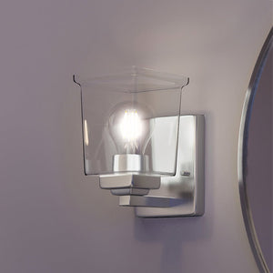A unique Craftsman Wall Sconce 7''H x 4.5''W, Brushed Nickel Finish, Houston Collection from Urban Ambiance with a light bulb on it.