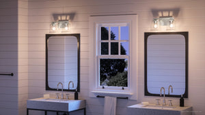 A bathroom with two sinks and a window featuring the unique UHP4291 Craftsman Bath Light fixture from the Houston Collection by Urban Ambiance.