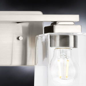 A unique UHP4291 Craftsman Bath Light 7''H x 12.25''W, Brushed Nickel Finish, Houston Collection lighting fixture with a clear glass bulb by Urban