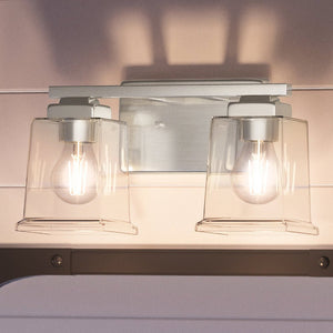 Two beautiful Urban Ambiance UHP4291 Craftsman Bath Light fixtures hanging on a wall.