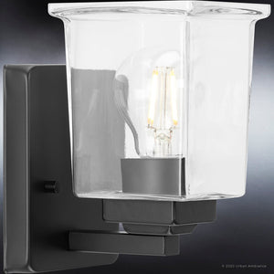 A beautiful UHP4294 Craftsman wall sconce with a midnight black finish and clear glass bulb.