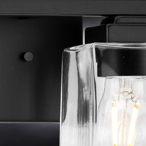 A luxury Craftsman Bath Light 7''H x 12.25''W, Midnight Black Finish, Houston Collection bathroom light fixture with a clear glass bulb by Urban Ambiance.