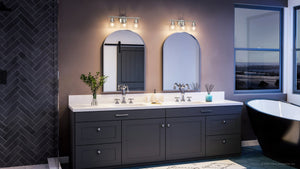 A bathroom with two UHP4302 Vintage Bath Light 7.875''H x 21''W, Polished Chrome Finish, Phoenix Collection sinks and a tub illuminated by luxury lighting fixtures