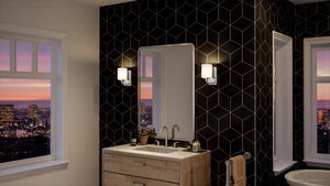 A beautiful Urban Ambiance bathroom with black and white tile and a window.