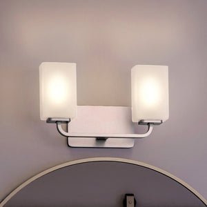 An Urban Ambiance UHP4321 Contemporary Bath Light 8.5''H x 13.5''W with a gorgeous Brushed Nickel Finish, Louisville Collection bathroom with a mirror.