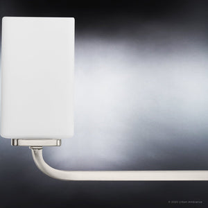 An unique lighting fixture from the Louisville Collection, the Urban Ambiance UHP4323 bath light features a square glass shade and a brushed nickel finish.