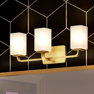 A bathroom with a unique Urban Ambiance lighting fixture, the UHP4326 Contemporary Bath Light 8.5''H x 23.5''W, Satin Gold Finish,