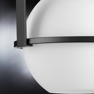 A beautiful and unique Mid-Century Modern pendant lighting fixture with a white sphere.