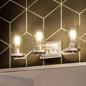 A beautiful Urban Ambiance bathroom light fixture with a unique geometric pattern on the wall.