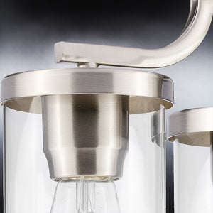 An elegant, luxury lighting fixture from the Mesa Collection featuring a unique brushed nickel finish and clear glass bulb.