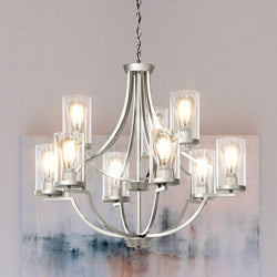 A gorgeous UHP4370 luxury chandelier with a glass shade hanging in front of a painting.