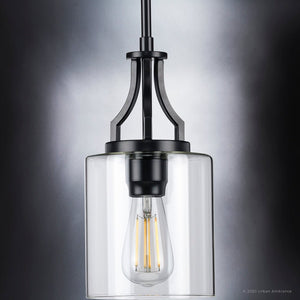 A beautiful Urban Ambiance UHP4373 Contemporary Pendant 12.5''H x 6.375''W, Midnight Black Finish, Mesa Collection with a clear glass shade.