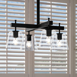 An Urban Ambiance UHP4385 Traditional Chandelier, a unique lighting fixture in Midnight Black Finish, from the Atlanta Collection that beautifully hangs three light bulbs over a window.