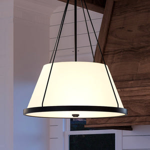 A beautiful pendant light hanging over a kitchen island.