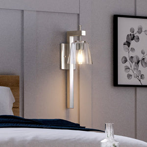 A luxurious bed in a room with a beautiful Urban Ambiance UHP4389 Traditional Wall Sconce.