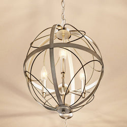A unique lighting fixture, the UHP4401 Farmhouse Chandelier by Urban Ambiance features a gorgeous metal sphere hanging from it.