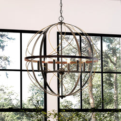 A gorgeous UHP4402 Farmhouse Chandelier lighting fixture hanging in front of a window.