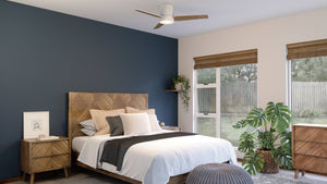A bedroom with unique blue walls and gorgeous wooden floors featuring the UHP9291 Mid-Century-Modern Ceiling Fan 9.75''H x 44''W, Matte White Finish from