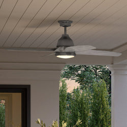 An Urban Ambiance ceiling fan on a porch adorned with a gorgeous potted plant.