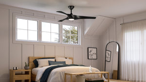 A beautiful bedroom with a bed and an Urban Ambiance UHP9361 Transitional Ceiling Fan 13.5''H x 52''W, Midnight Black Finish, Geraldton Collection.