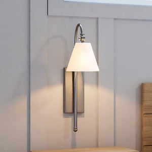 A beautiful bedroom with a ULB2053 New-Traditional Wall Sconce, 25''H x 7''W, Brushed Nickel Finish from the Jidava Collection by Urban Amb