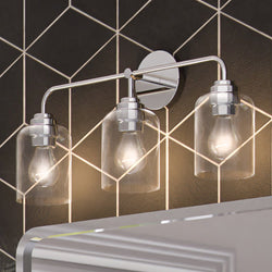 A bathroom with a unique lighting fixture - three ULB2092 New-Traditional Bath Lights, 11''H x 23''W, Polished Chrome Finish, from the Petra Collection by Urban