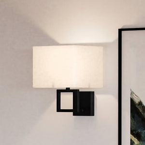 A unique lighting fixture, the Urban Ambiance ULB2140 New-Traditional Wall Sconce pairs a matte black finish with a white shade.