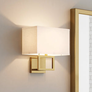A unique ULB2142 New-Traditional Wall Sconce, 10''H x 8''W, Brushed Brass Finish, Kells Collection with a white shade by Urban