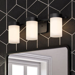 An Urban Ambiance bathroom with a beautiful ULB2153 New-Traditional Bath Light and unique Cashel Collection tiled wall.