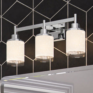 Three ULB2161 New-Traditional Bath Lights, 9''H x 22''W, Brushed Nickel Finish, Kilkenny Collection bathroom fixtures with a black and white tiled wall by