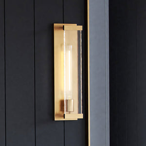 An ULB2172 Transitional Wall Sconce, 17''H x 5''W, Brushed Brass Finish from the Kinsale Collection by Urban Ambiance on a black wall is