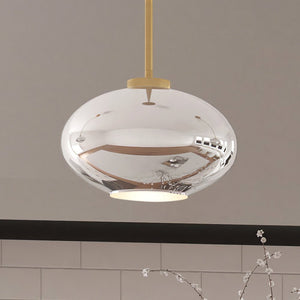 An unique ULB2250 Mid-Century Modern Pendant with a luxury brushed brass finish, hanging over a kitchen counter.
