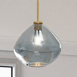 A unique ULB2290 Mid-Century Modern Pendant, 10''H x 11''W, hanging in a room.