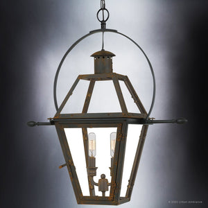 The Urban Ambiance UQL1378 Historic Outdoor Pendant Light from the Paris Collection, measuring 23.5 inches high by 21.25 inches wide and finished in Bygone Bronze, showcases a handcrafted colonial-inspired geometric metal frame with two exposed bulbs inside, suspended by a chain against a plain background.