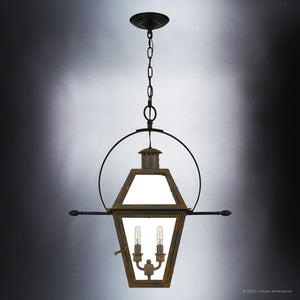 The UQL1378 Historic Outdoor Pendant Light from Urban Ambiance’s Paris Collection features a Bygone Bronze finish and glass panels. Suspended from the ceiling by a chain, this 23.5″H x 21.25″W fixture is inspired by handcrafted colonial gas lanterns and showcases three candle-style bulbs inside.