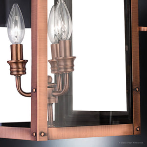 Close-up of the Urban Ambiance UQL1411 Vintage Outdoor Wall Light from the Longview Collection, showcasing its rustic copper finish, two exposed bulb sockets, clear glass panels, and sturdy metal frame against a white background.