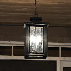 A unique Craftsman Outdoor Pendant fixture, from the Peacehaven Collection, hanging from a doorway.