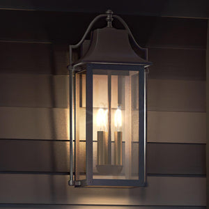 The Urban Ambiance UQL1673 Vintage Outdoor Wall Sconce from the Eastbourne Collection features an Estate Bronze finish, durable marine-grade construction, and elegant design, standing 21.25''H x 10.5''W—perfect for outdoor horizontal siding.