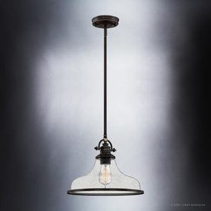 A luxury Urban Ambiance light fixture with a clear glass shade, featuring the UQL3664 Traditional Pendant 10.75''H x 13.5''W, Parisian Bronze Finish,