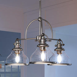 Gorgeous UQL3667 Traditional Chandelier 15.5''H x 24''W, Brushed Nickel Finish, Pasadena Collection light chandelier in a kitchen with glass shades.