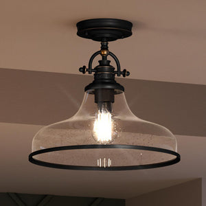 An Urban Ambiance UQL3668 Traditional Ceiling lighting fixture with a Parisian Bronze Finish from the Pasadena Collection, featuring a glass shade and a black frame.
