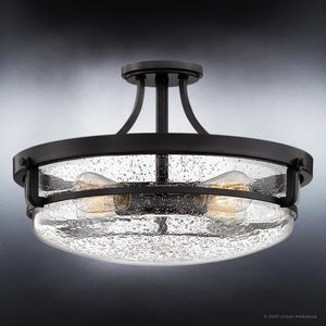 An UQL3782 Coastal Ceiling 12''H x 19''W, Parisian Bronze Finish, Andover Collection by Urban Ambiance three - light semi - flush fixture with unique frosted