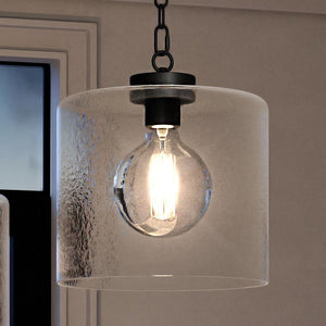 An UQL3791 Modern Farmhouse Pendant 13.25''H x 12''W, Matte Black Finish, Bideford Collection hanging over a window by Urban Ambiance is a gorgeous