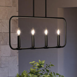 An UQL3797 Modern Farmhouse Chandelier with a beautiful Matte Black Finish, Bideford Collection from Urban Ambiance with four candles hanging from it.