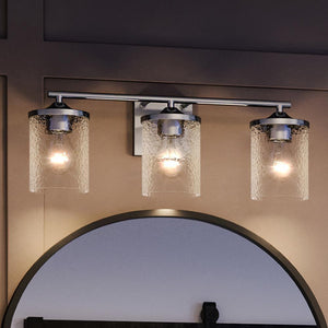 An Urban Ambiance bathroom lighting fixture with a unique design and a round mirror above it.