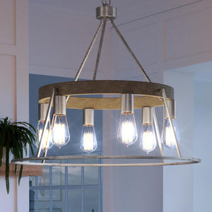 A luxury lighting fixture, the Urban Ambiance UQL3830 Contemporary Chandelier, enhances the ambiance of a living room with its burnished silver finish and ample light bulbs.
