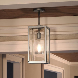 A beautiful lamp hanging from the ceiling in a living room.