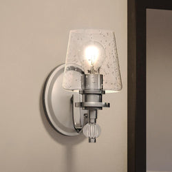 A gorgeous Urban Ambiance UQL3870 Posh Wall Sconce 9.5''H x 5''W with a glass shade.