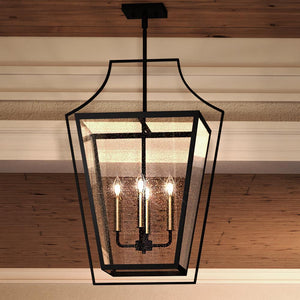 A beautiful UQL3960 Cosmopolitan Chandelier, a luxury lighting fixture with Black Bronze Finish from the Keighley Collection, hangs from a wooden ceiling in a dining room.