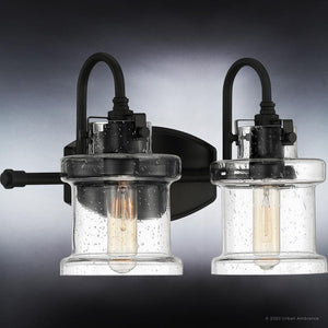 Two gorgeous Modern Farmhouse Bath Fixtures with clear glass bulbs on a black background.